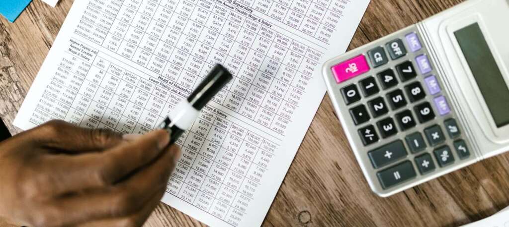 Tax accountants near Robina showing a calculator