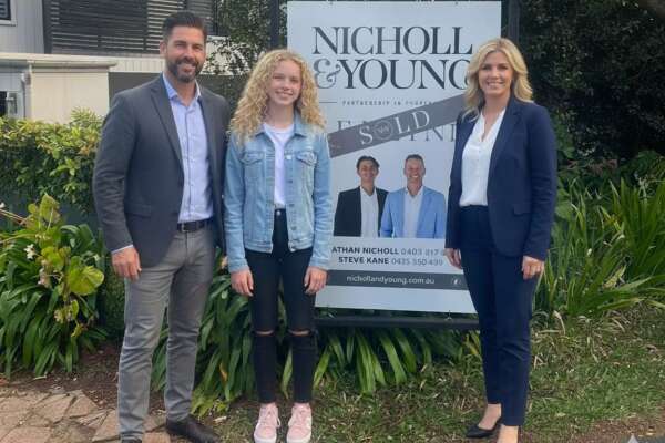 Property investment family celebrating sale